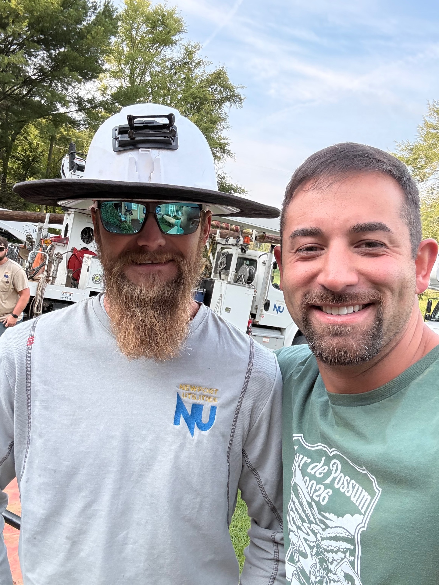Ryan Trent with a Newport Utilities lineman on an electrical service job site
