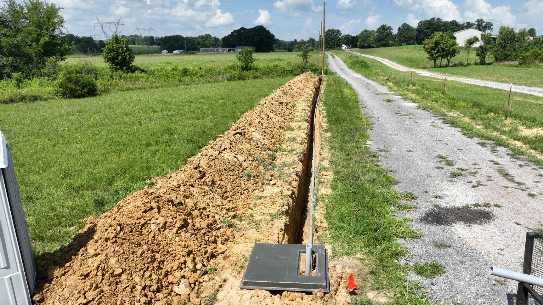 Underground electrical conduit laid in a trench across a rural Tennessee yard